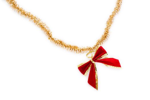 Red christmas bow hang on golden ribbon isolated on white background