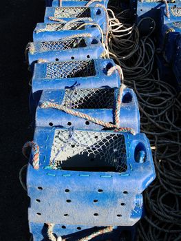 Modern blue lobster pots. these seem to have been made out of old plastic containers.