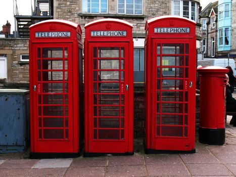 Three telephone boxes and a post box