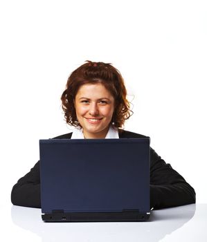 Portrait of a business woman working on a laptop over white background