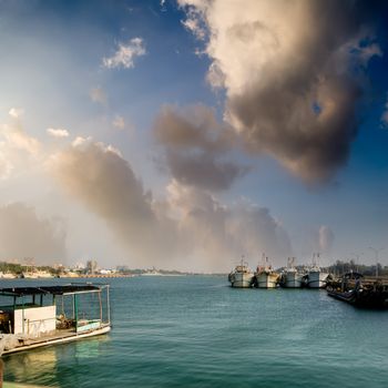 Dramatic scenery of sea port with boats.