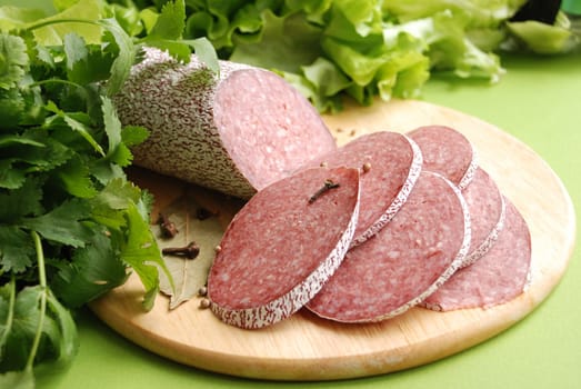 Salami sausage and lettuce close up