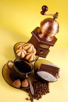 Cup of black coffee and cookies close up