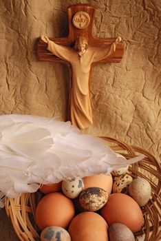 Easter eggs, wings and crucifixion close up