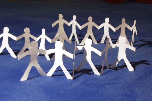team of paper people having a party