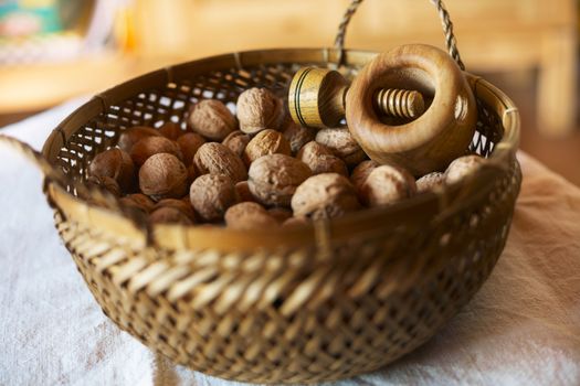 Bowl of mixed walnuts with nutcracker