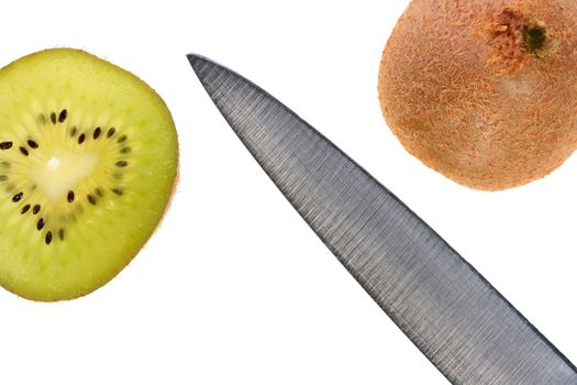 The tropical fruit kiwi is cut half-and-half, between slices the knife on a white background lies.