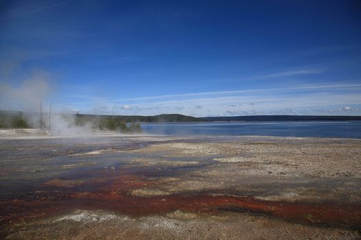 Colorful geothermal hot springs on the shore of Yellowstone Lake