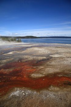 Colorful geothermal hot springs on the shore of Yellowstone Lake