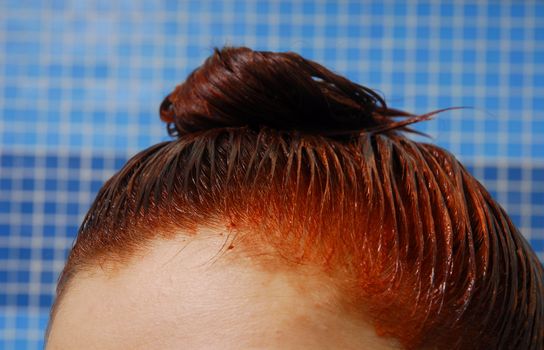 Head with dyeing wet red hair