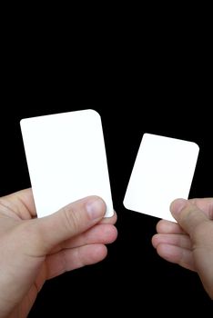 Photo of empty cards in hands on a black background, to be personalised