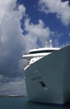 Cruise liner stationary against a blue cloudy sky