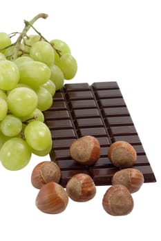 Slab of chocolate with nuts on white background
