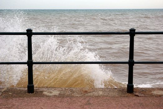 Photo on a wave that brakes onto a barrier