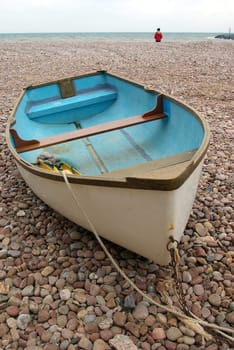 Photo of a boat parked on a pebble beach in Devon