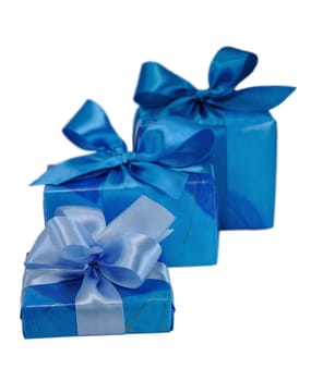 Three Blue Gift Boxes with Bows Isolated on White