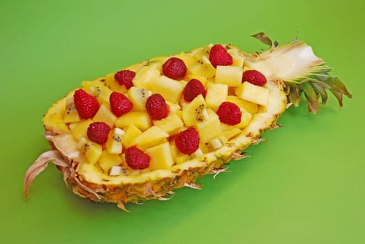 Delisious fresh fruit salad in half of pineapple