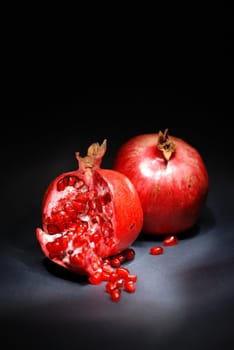 Piece of pomegranate on black background