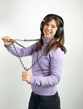 Pretty woman listening to music with headphone