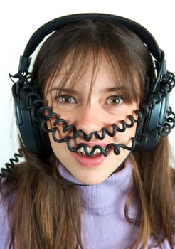 Pretty woman listening to music with headphone