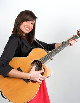 Pretty woman playing with guitar