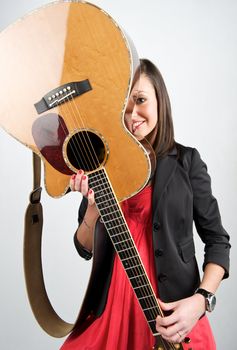 Pretty woman playing with guitar