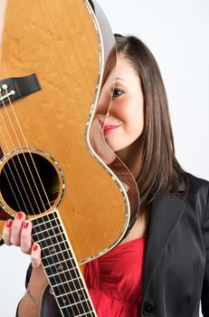 Pretty woman playing with guitar