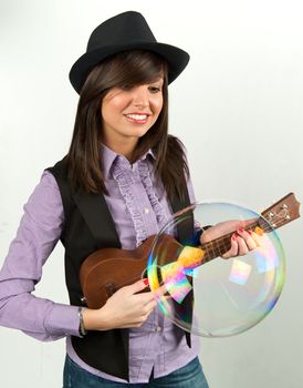 Pretty woman playing with guitar