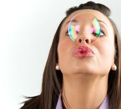 Pretty young woman posing with some bubbles around her