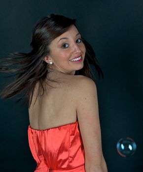 Pretty young woman posing with some bubbles around her