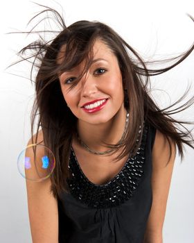 Pretty young woman posing with some bubbles around her