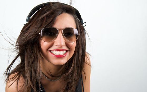 Pretty woman listening to music with headphone