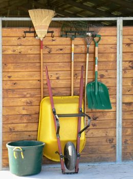 Tools neatly organized on barn wall