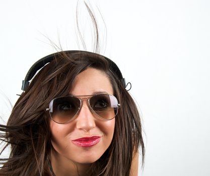 Pretty woman listening to music with headphone