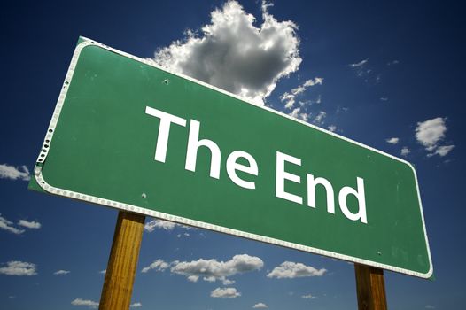 The End Road Sign with dramatic blue sky and clouds.