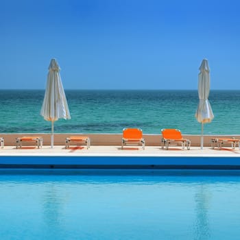 sunny day on a swimming pool, beach view 