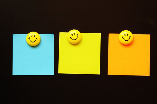 smilie or smily with empty sheet of paper and copyspace