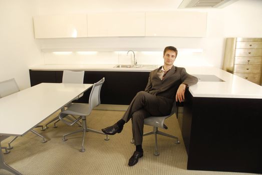 Man in suit in the modern kitchen