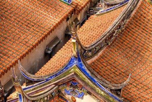 China classic roof with red tile and colorful decoration.