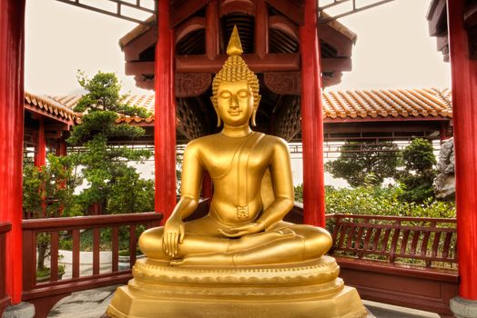 Buddha statue in golden color in Chinese classic blinding.