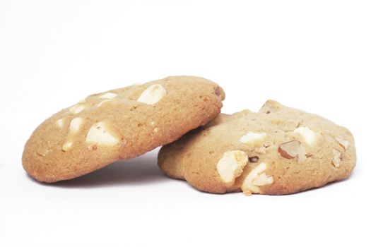 Two Cookie Biscuit With White Chocolate And Macadamia Nuts, Plain Background