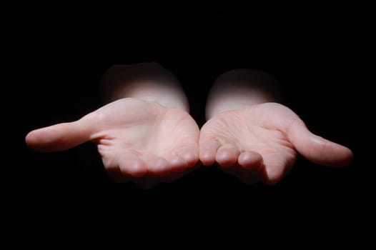 empty hands isolated on a black background