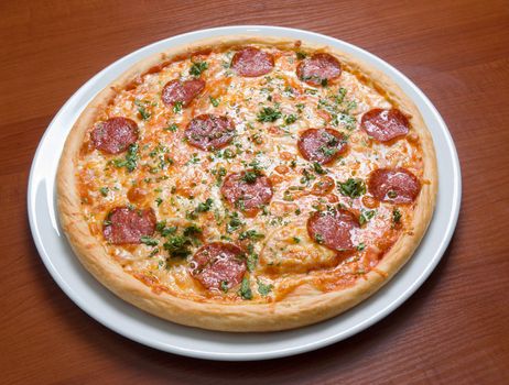 Pizza Pepperoni on plate.Italian kitchen