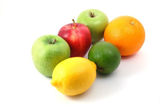 fruits like apple , lemon , citron orange and lime isolated on a white background