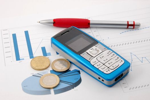 blue cell phone over business chart showing success