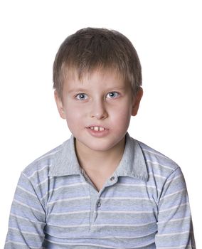 Photo of adorable young boy looking at camera over white