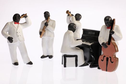 A group of black jazz musicians played. The group consists of five different musicians from a white background