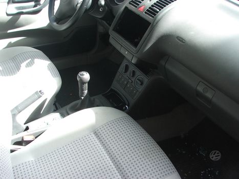 a car dash with a hole in place of the stereo, just robbed