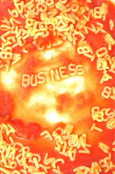 business success concept with red tomato alphabet pasta