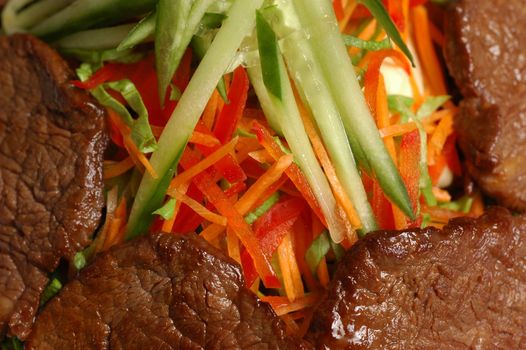 Meat with vegetables (cucumbers, carrot, Bulgarian pepper) 